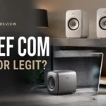 Eu KEF Com review 2026 featured image showing white KEF speakers in a modern home office setup with scam or legit text